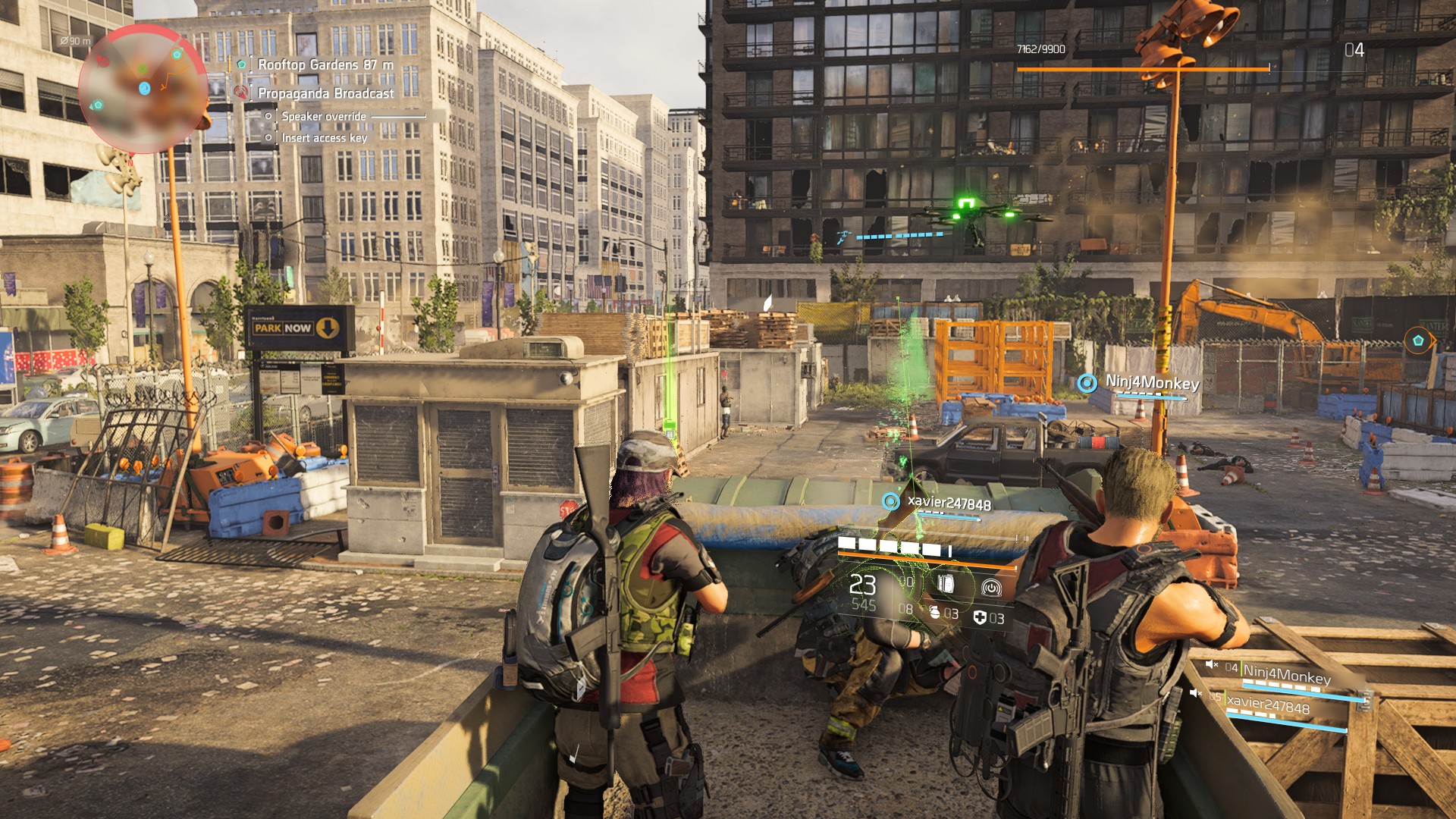 Screenshot from The Division 2 in an urban environment with characters in tactical gear