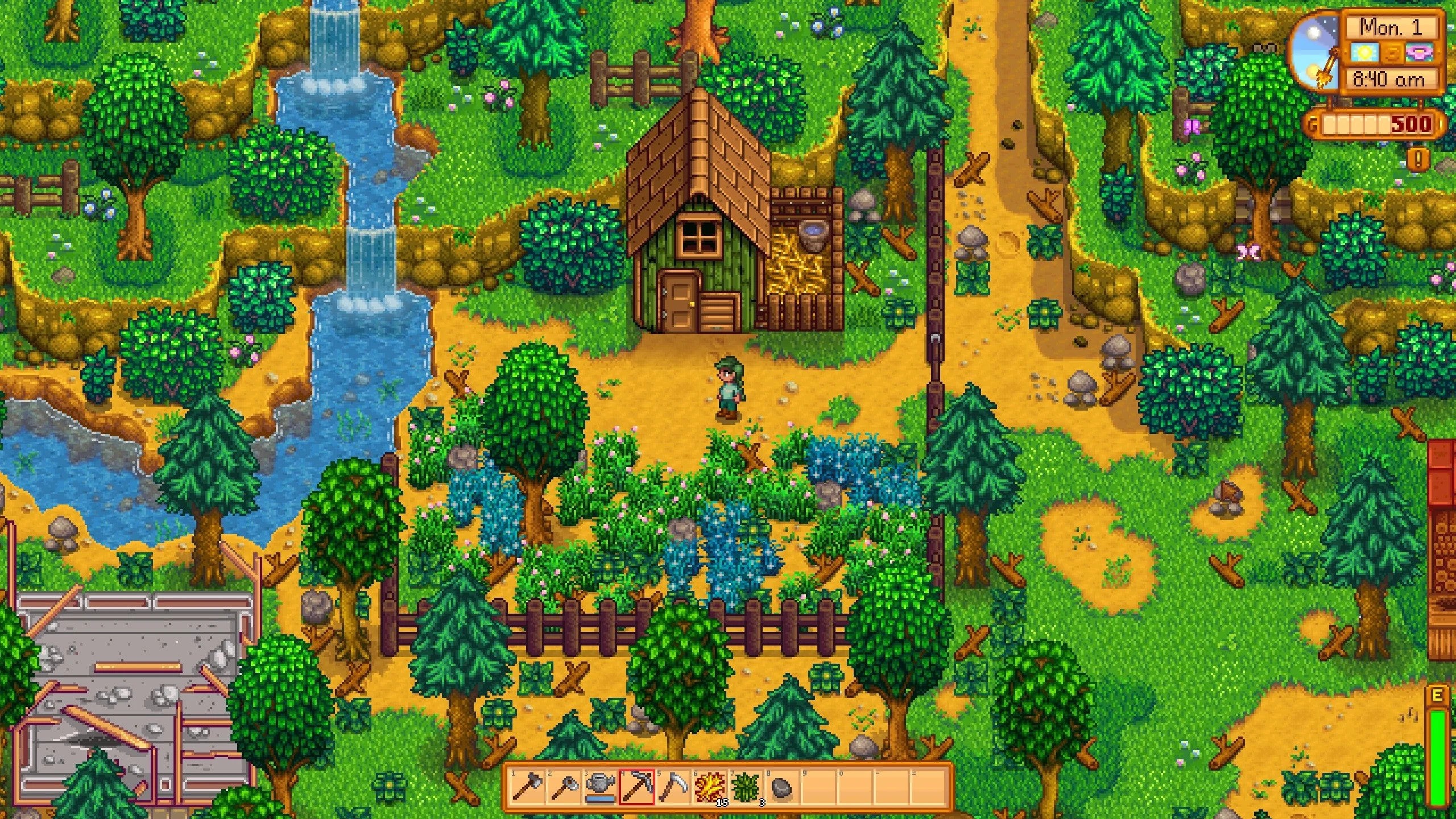 Screenshot from Stardew Valley showing a vibrant farm landscape with crops